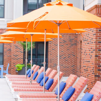 Beach chairs and orange umbrella